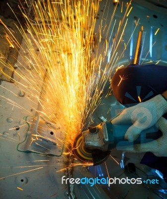 Hand Of Worker Working With Electric Wheel Stock Photo