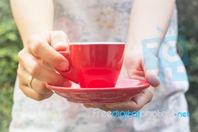 Hand On Cup Of Coffee With Vintage Filter Stock Photo