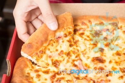 Hand On Extra Cheese Pizza Pan Stock Photo