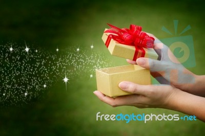 Hand Opening Present Box Stock Photo