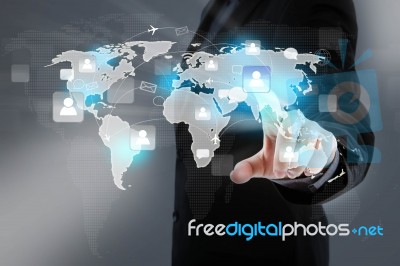 Hand Point To Social Network And World Map Stock Photo