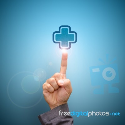 Hand Press On First Aid Sign Stock Photo