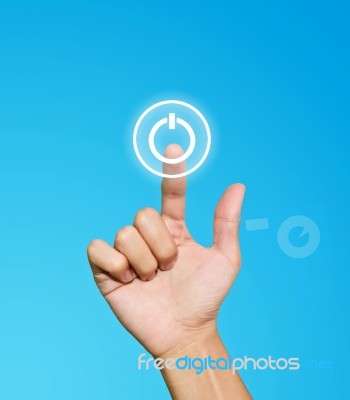 Hand Pressing Power Button Stock Photo