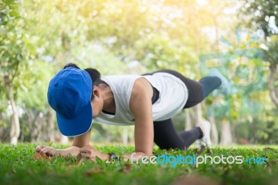 Hand Push-up. Confident Muscled Young Women Wearing Sport Wear A… Stock Photo