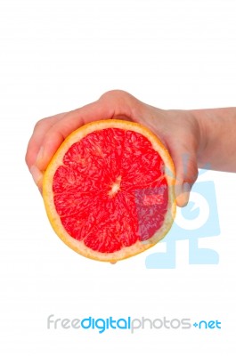 Hand Squeezing An Orange Stock Photo