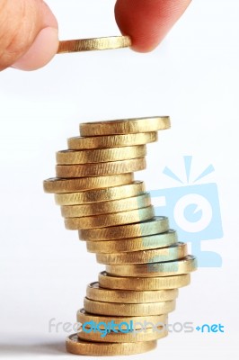 Hand Stacked Gold Coins Stock Photo