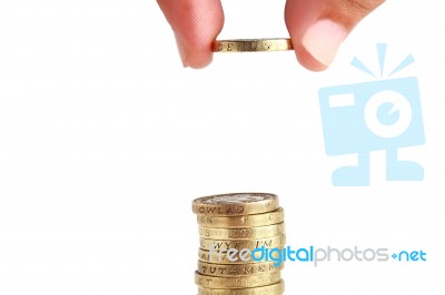 Hand Stacked Gold Coins Stock Photo