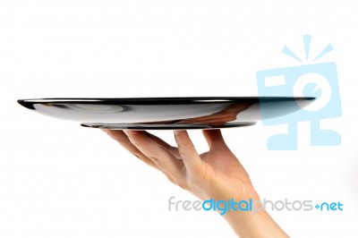 Hand With Empty Plate Stock Photo