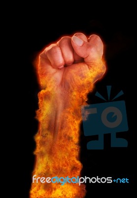 Hand With Fire Burning On Black Background Stock Photo