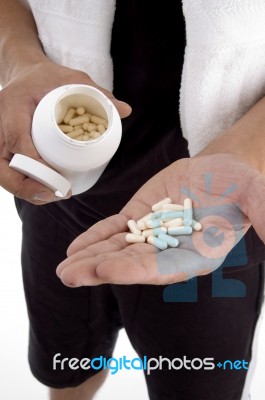 Hand With Pills And Bottle Stock Photo