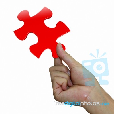 Hand With Red Puzzle Stock Photo