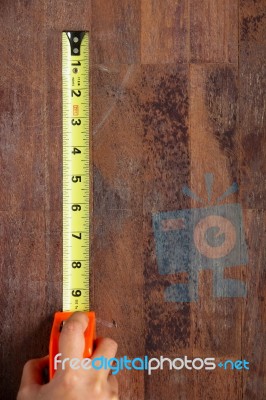 Hand With Tape Measure Stock Photo