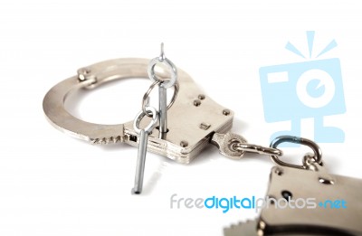 Handcuffs And Key Stock Photo