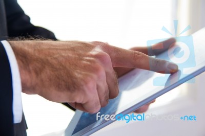 Hand's Detail Of Businessman Using A Digital Tablet Stock Photo