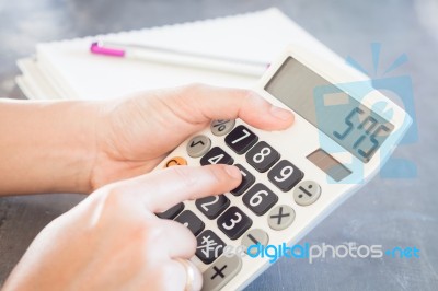 Hands Holding And Press Calculator Stock Photo