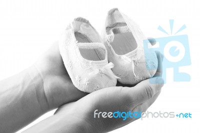 Hands Holding Baby Shoes Stock Photo Hands Holding Baby Shoes Stock Photo