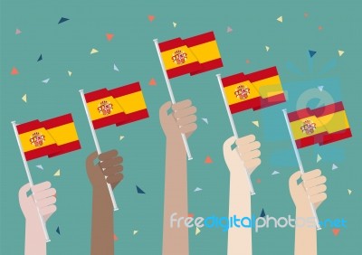 Hands Holding Up Spain Flags Stock Image