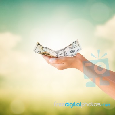 Hands Holding Us Dollars Note With Natural Background Stock Photo