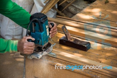 Hands Of A Carpenter Planed Wood Stock Photo
