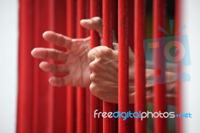 Hands Of Prisoner In Jail Stock Photo