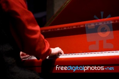 Hands Of The Pianist At The Red Piano Stock Photo