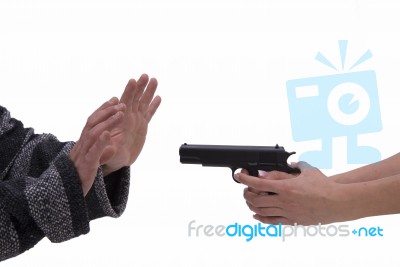 Hands Of Woman And Man With Pistol Stock Photo