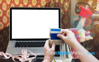 Hands Pull Credit Or Debit Card Out Of Wallet And Laptop Or Note… Stock Photo