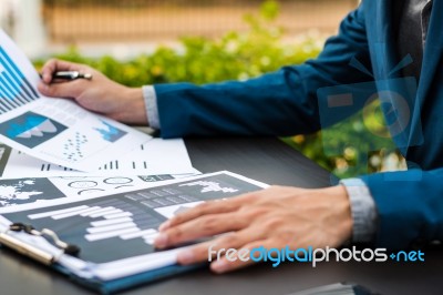 Handsome Businessman Wearing Suit And Using Modern Laptop Outdoo… Stock Photo