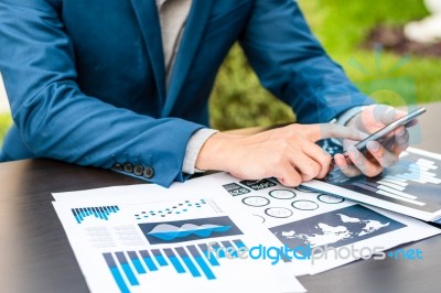 Handsome Businessman Wearing Suit And Using Modern Laptop Outdoo… Stock Photo