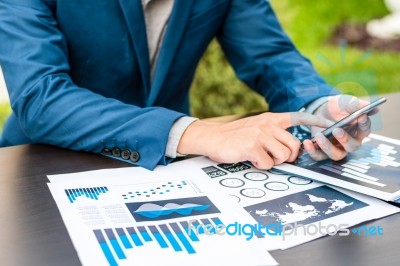 Handsome Businessman Wearing Suit And Using Modern Laptop Outdoo… Stock Photo