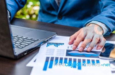 Handsome Businessman Wearing Suit And Using Modern Laptop Outdoo… Stock Photo