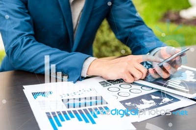 Handsome Businessman Wearing Suit And Using Modern Laptop Outdoo… Stock Photo