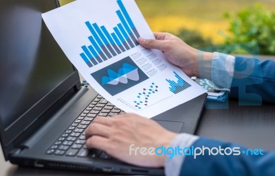 Handsome Businessman Wearing Suit And Using Modern Laptop Outdoo… Stock Photo