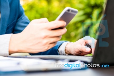 Handsome Businessman Wearing Suit And Using Modern Laptop Outdoo… Stock Photo