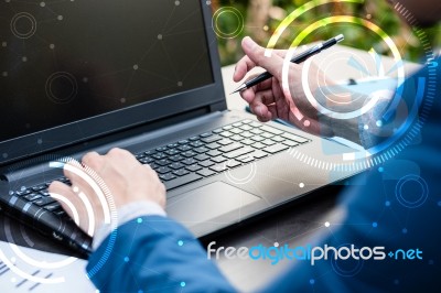 Handsome Businessman Wearing Suit And Using Modern Laptop Outdoo… Stock Photo