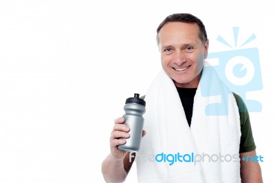 Handsome Man Holding Bottle In Hand Stock Photo