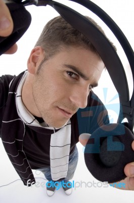 Handsome Man Holding Headphone Stock Photo