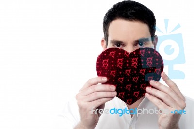 Handsome Man Holding Heart Shape Gift Box Stock Photo
