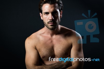 Handsome Muscular Male Model Posing Over Black Background Stock Photo