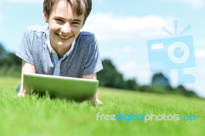 Handsome Young Boy With Tablet Device, Outdoors Stock Photo Handsome Young Boy With Tablet Device, Outdoors Stock Photo