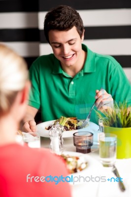 Handsome Young Guy Enjoying His Meal Stock Photo