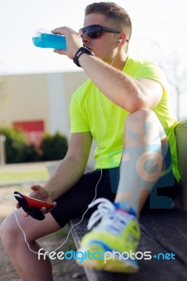 Handsome Young Man Drinking After Running Stock Photo