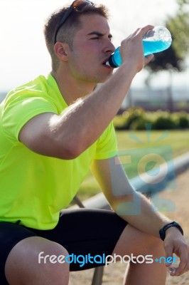 Handsome Young Man Drinking After Running Stock Photo