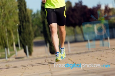 Handsome Young Man Running In The Park Stock Photo