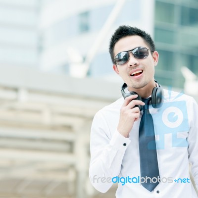 Handsome Young Man Smiling Outdoors Stock Photo