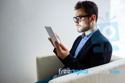 Handsome Young Man Working With Digital Tablet In The Office Stock Photo