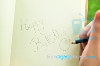 Handwriting Happy Birthday On Notebook Stock Photo