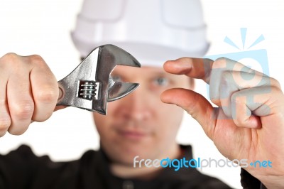 Handyman Wearing Uniform And Hardhat Stock Photo