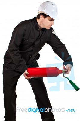 Handyman Wearing Uniform And Hardhat Stock Photo