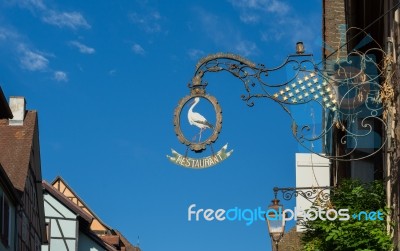 Hanging Sign In Riquewihr In Haut-rhin Alsace France Stock Photo